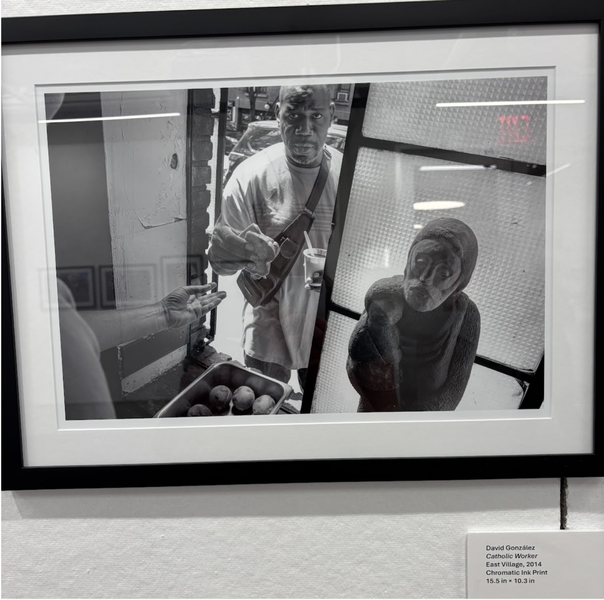 This photo included in the exhibit shows the bread line outside the window of the Catholic Worker in the Lower East Side. (Erynn Sweeney/The Fordham Ram)